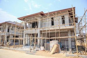 house under construction with autoclaved aerated concrete block structure at building site photo