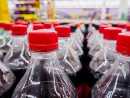 Carbonated soft drink bottles close up photo