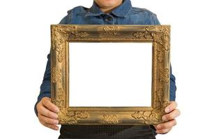 A blank diploma or a mockup certificate in the hand of a woman employee wearing a denim shirt on white background with a clipping path. The vertical picture frame is empty and the copy space. photo