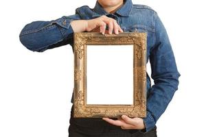 A blank diploma or a mockup certificate in the hand of a woman employee wearing a denim shirt on white background with a clipping path. The vertical picture frame is empty and the copy space. photo