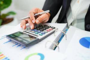 Businessman working and analysis with statistic graph in office. photo