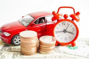 Car on coins money, saving bank, finance, installment payment, car loan interest. photo