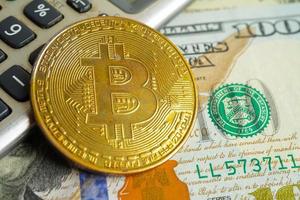 Golden bitcoin on US dollar banknotes money for business and commercial, Digital currency, Virtual cryptocurrency, blockchain technology. photo
