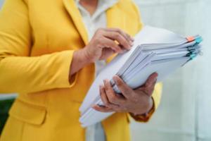 Businessman working and prepare paperwork report data to analysis information in file binder at office. photo