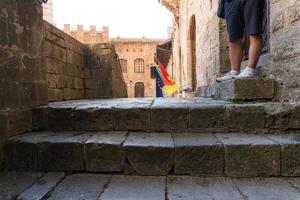 San Gimignano,Italy-august 8,2020 people visit and strolling in Saint Gimignano during a sunny day. photo