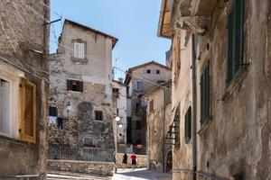 Scanno, Italy-august 8, 2021 Strolling through the narrow streets of Scanno, one of the many ancient villages of Italy during a summer day photo