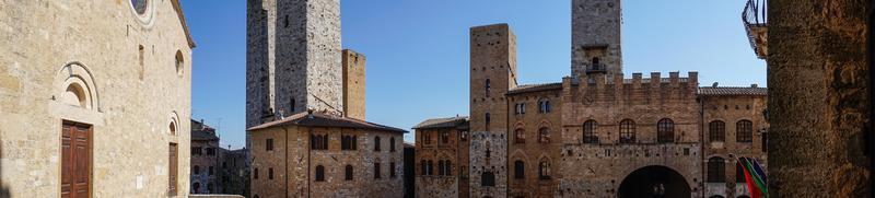 San Gimignano,Italy-august 8,2020 strolling in Saint Gimignano during a sunny day. photo