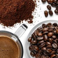 Coffee beans and ground coffee top view on a white background photo