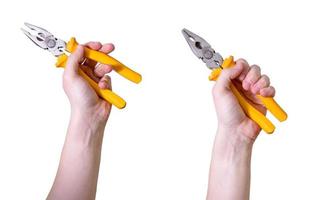 The man's hand is holding yellow pliers insulated against a white background. photo