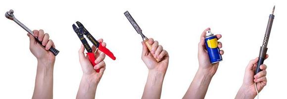 Hands holding hand tools, insulated on white background. photo