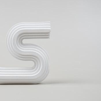 White plaster in various shapes separate from the background photo