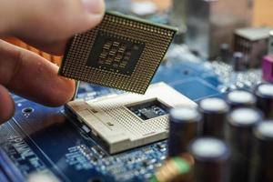 Hand assembled to inspect the electronic circuit board. photo