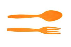 Orange plastic spoon isolated on white background with clipping path. photo