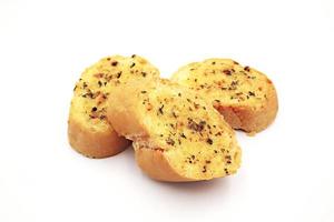 Garlic and herb bread slices on white background. photo