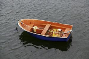 Old wooden boat in the sea photo