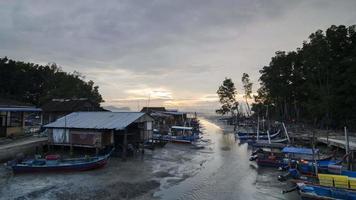 Timelapse sunset fishing village. video