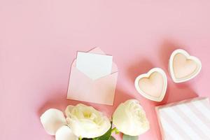 Flowers composition. Rose flower petals on pastel pink background. Valentines day, mothers day, womens day concept. Flat lay, top view, copy space photo