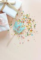 Birthday party background with gift and lollipops. Copy space. photo