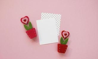 Happy Valentines Day composition. Blank greeting card mockup on pink background photo