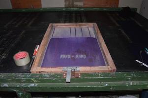 Gresik, indonesia, 2022 - manual screen printing tool in a printing factory photo