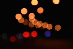 Bokeh street light at night time in urban city of thailand. photo