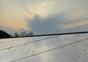 Photovoltaic panel rooftop of the building which dirty with dust, bird dropping on the surface photo