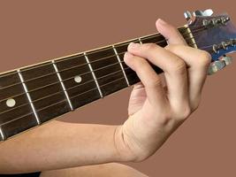 Isolated fingers and hand which is playing the guitar with clipping paths. photo