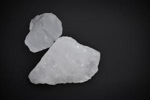 Alum cubes on dark background. photo