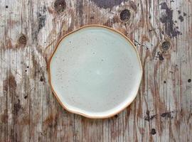 Empty plate in the wood photo