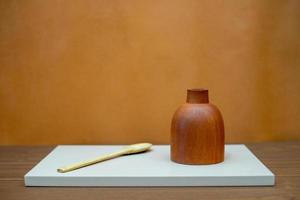 kitchen objects are arranged on the table with conceptual art. abstract compositions for decorating the living room or kitchen table. minimalist wood cooking tools photo