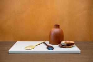 kitchen objects are arranged on the table with conceptual art. abstract compositions for decorating the living room or kitchen table. minimalist wood cooking tools photo