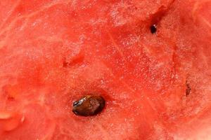 red pulp of juicy ripe watermelon with watermelon seed photo