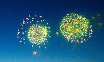 two fireworks on dark blue sky.Abstract holiday background. photo