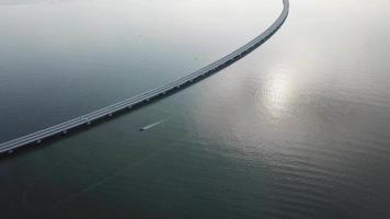 Aerial a boat sail beside Penang second bridge. video