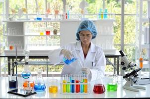 The woman scientist doing experiment. photo