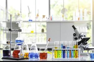 Chemical Liquid test tube and Microscope in Laboratory. photo