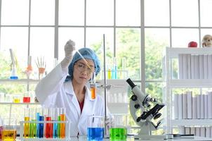 The woman scientist doing experiment. photo