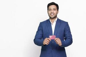 Young business man in suit shirt posing on isolated background. photo