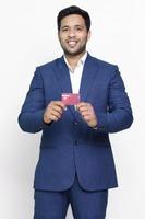 Young business man in suit shirt posing on isolated background. photo