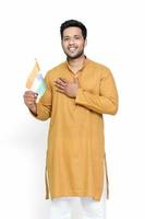 Indian man holding indian flag and showing patriotism. photo