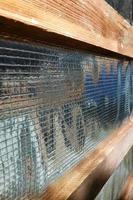 Insulation of the roof of the house on the inside with the use of a wrapper film and fixing boards photo