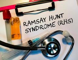 Health and medicine concept for Ramsay Hunt Syndrome medical term on black background with medical equipment's. photo