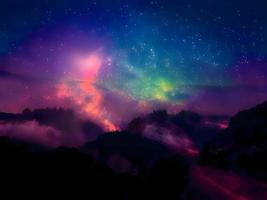 paisaje nocturno montaña y fondo de la galaxia de la vía láctea, larga exposición, poca luz foto