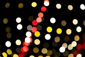 Abstract bokeh light effects on the night. Black background with colorful light effects. background with  Blur bokeh effects. Abstract background texture photo