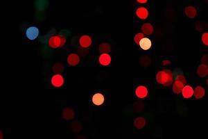 Abstract bokeh light effects on the night. Black background with colorful light effects. background with  Blur bokeh effects. Abstract background texture photo