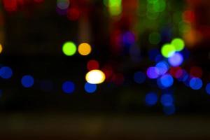 Abstract bokeh light effects on the night. Black background with colorful light effects. background with  Blur bokeh effects. Abstract background texture photo