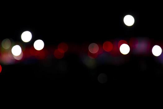 Abstract bokeh light effects on the night. Black background with colorful light effects. background with  Blur bokeh effects. Abstract background texture photo