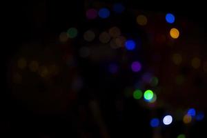 Abstract bokeh light effects on the night. Black background with colorful light effects. background with  Blur bokeh effects. Abstract background texture photo