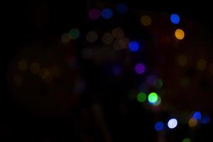 Abstract bokeh light effects on the night. Black background with colorful light effects. background with  Blur bokeh effects. Abstract background texture photo