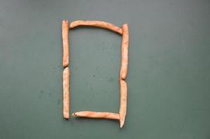 Letters of the english alphabet laid out from french fries photo